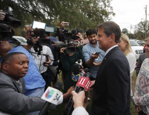 Georgia's Kemp big in small towns; Abrams awaits metro votes